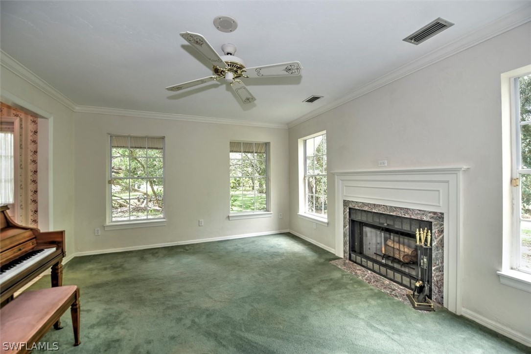 15180 Briar Ridge Circle Fort Myers, FL 33912 - Photo 8 of 35 a view of an empty room with window and fireplace