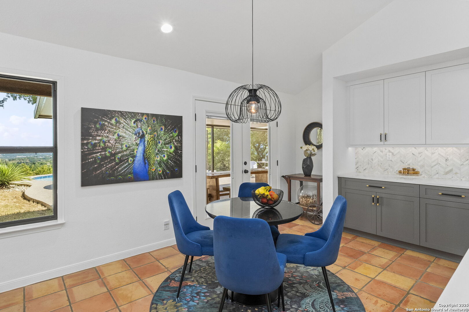 26938 Karsch Road Boerne, TX 78006 - Photo 12 of 60 a view of a dining room with furniture a chandelier and wooden floor