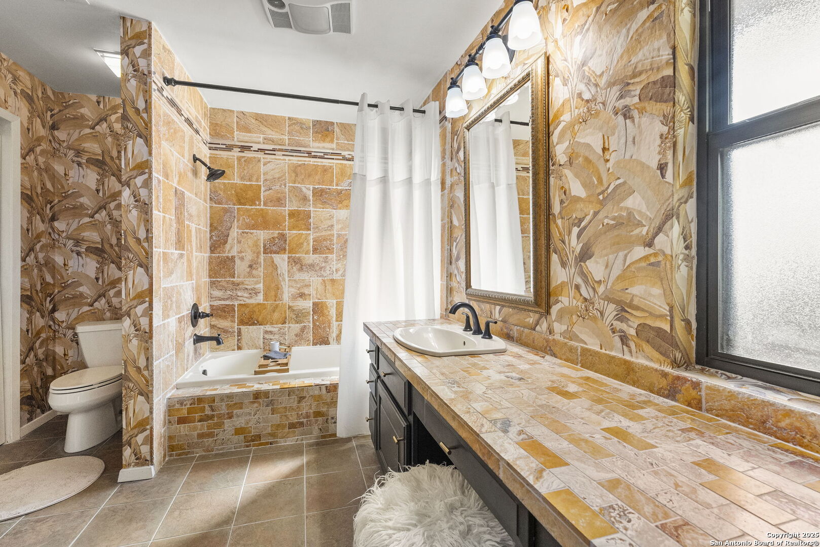 26938 Karsch Road Boerne, TX 78006 - Photo 17 of 60 a bathroom with a granite countertop sink and a bathtub