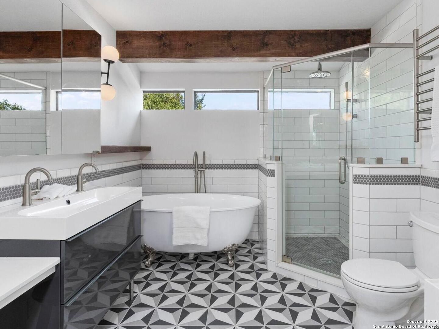 26938 Karsch Road Boerne, TX 78006 - Photo 21 of 60 a bathroom with a sink toilet and shower