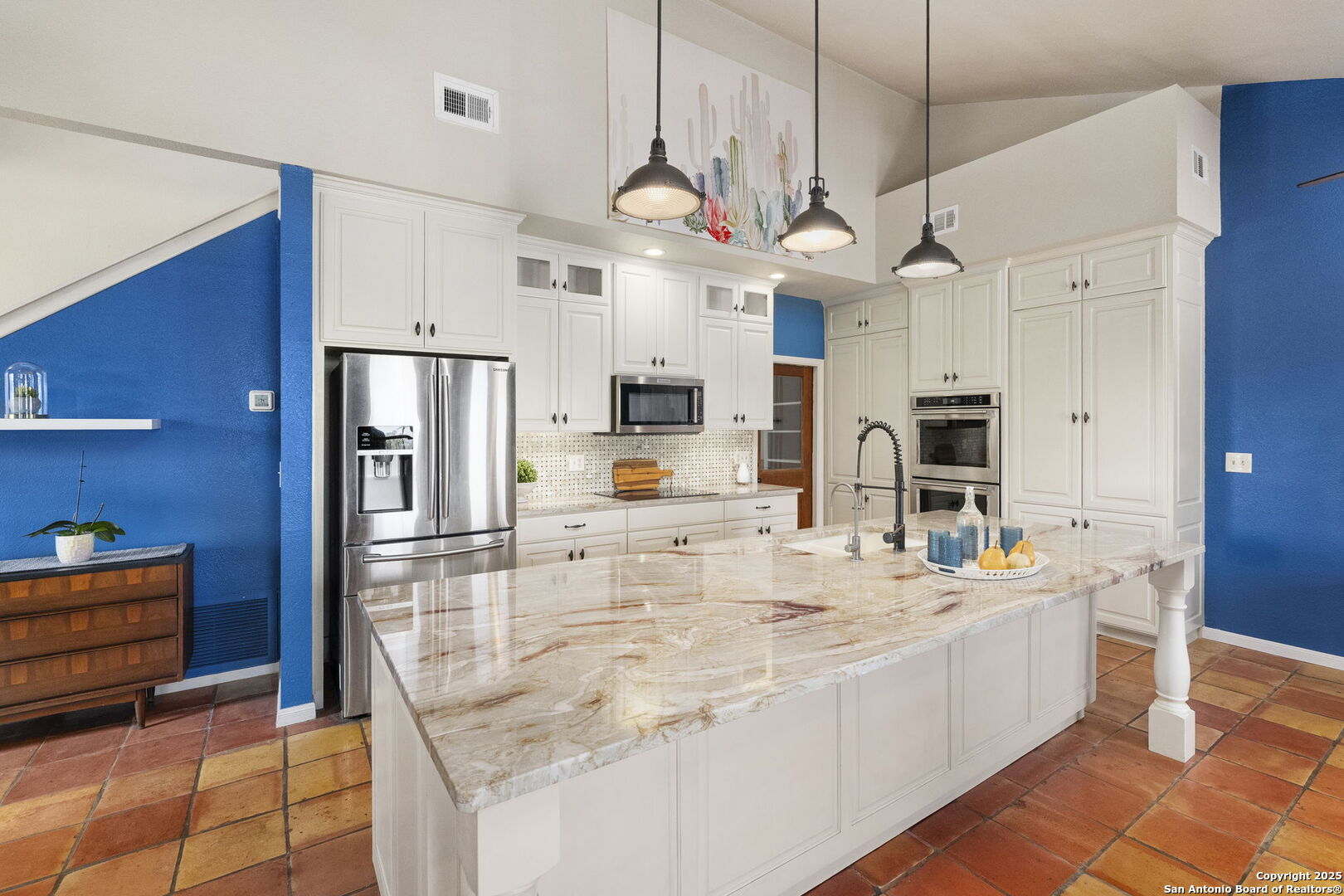 26938 Karsch Road Boerne, TX 78006 - Photo 24 of 60 a large kitchen with kitchen island a large island a sink stainless steel appliances and cabinets