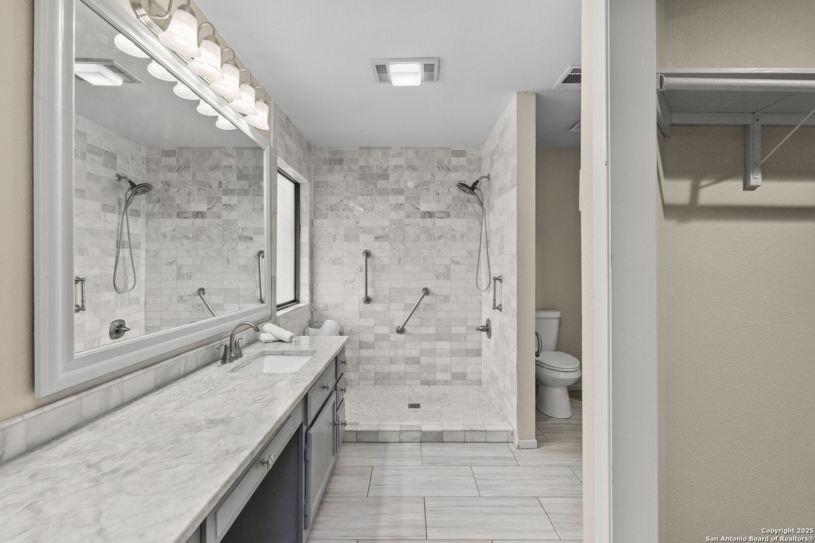 26938 Karsch Road Boerne, TX 78006 - Photo 31 of 60 a bathroom with a granite countertop sink mirror and shower