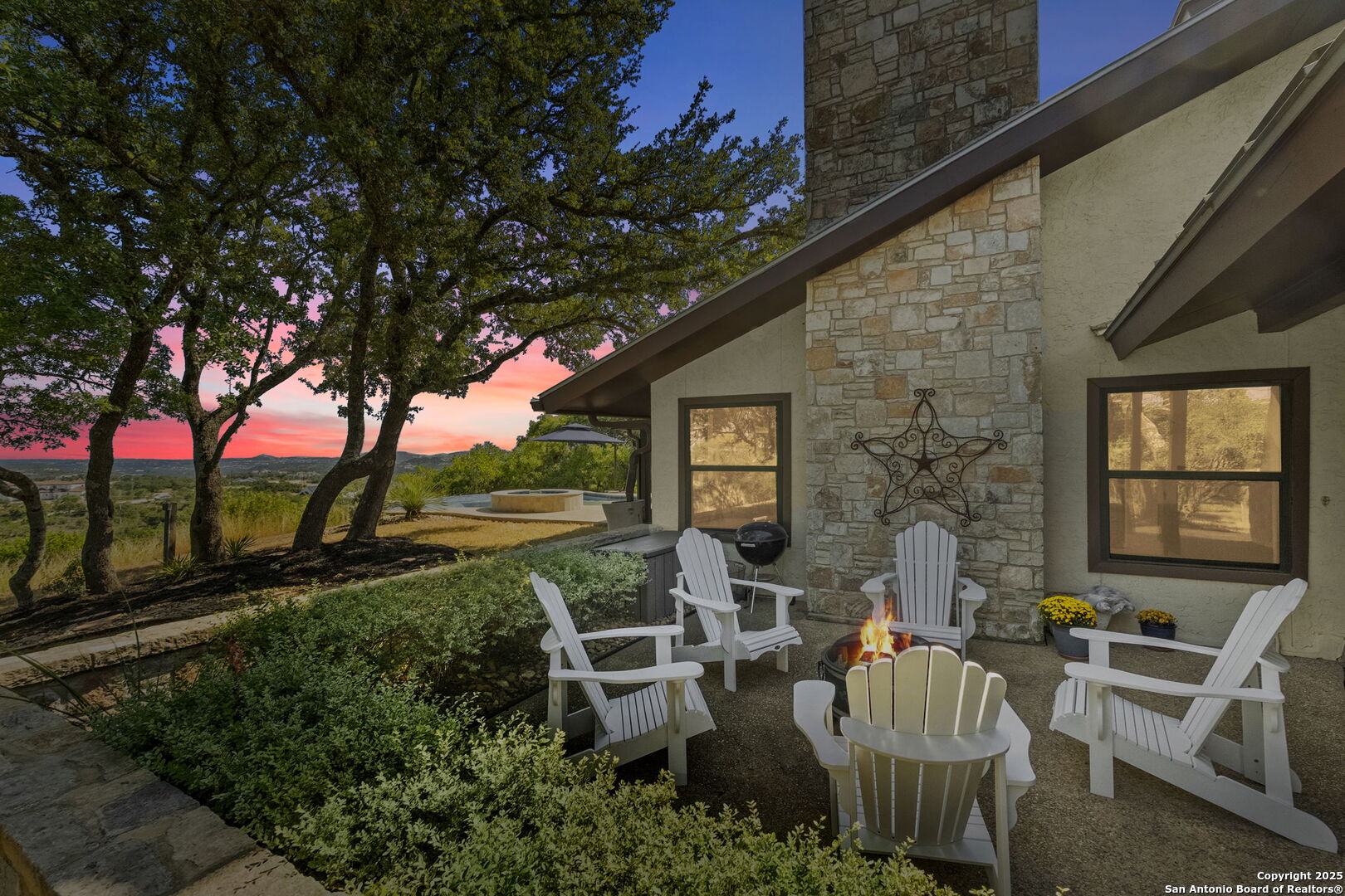 26938 Karsch Road Boerne, TX 78006 - Photo 37 of 60 a view of a patio with couches table and chairs and potted plants