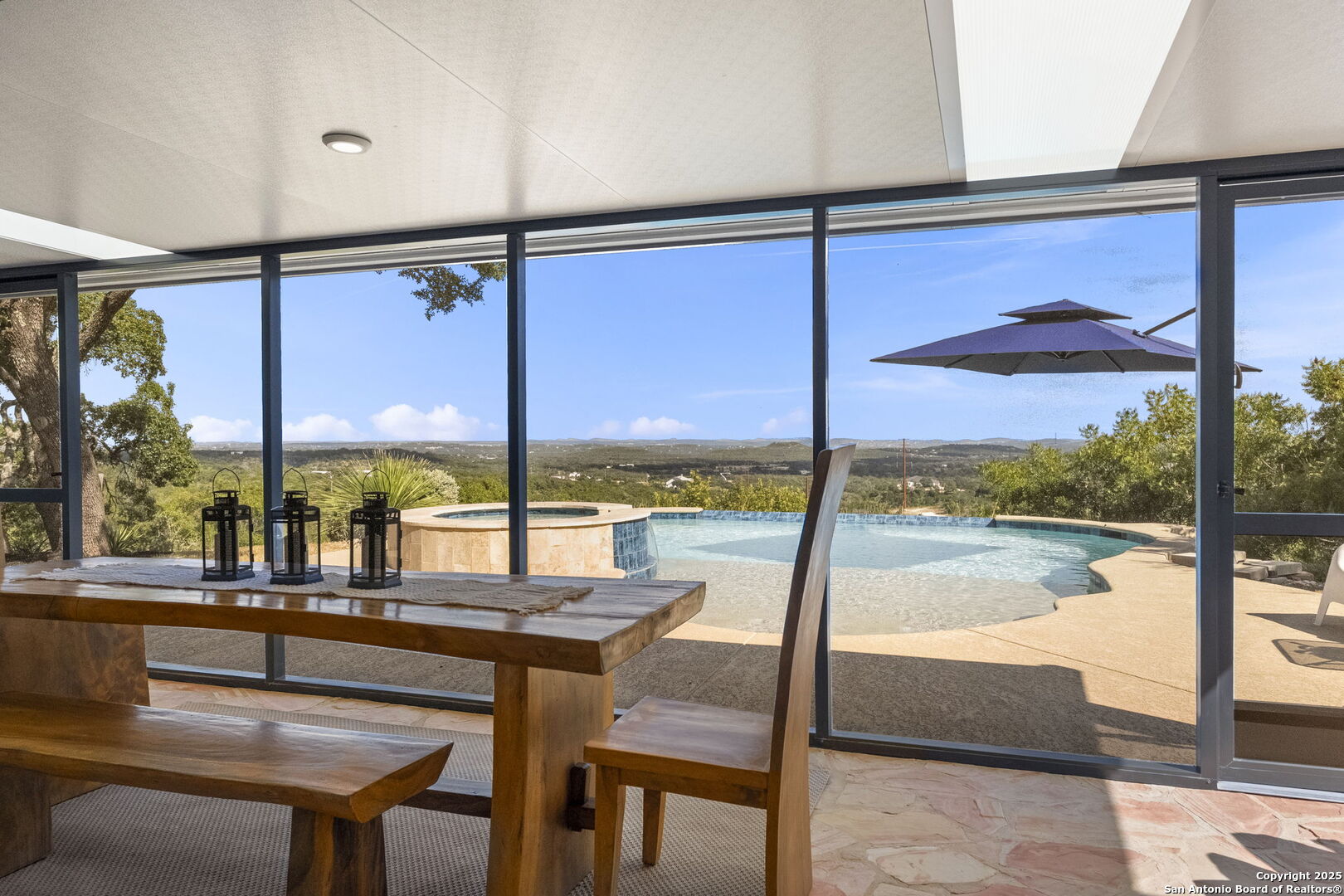 26938 Karsch Road Boerne, TX 78006 - Photo 5 of 60 a view of a floor to ceiling window with a kitchen