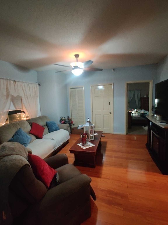 1031 Worcester Street Springfield, MA 01151 - Photo 5 of 20 a living room with furniture and a wooden floor
