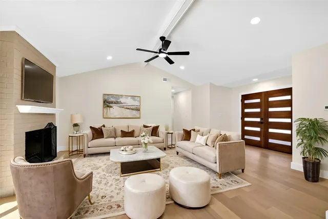 an aerial view of a house with a yard lake house and outdoor seating