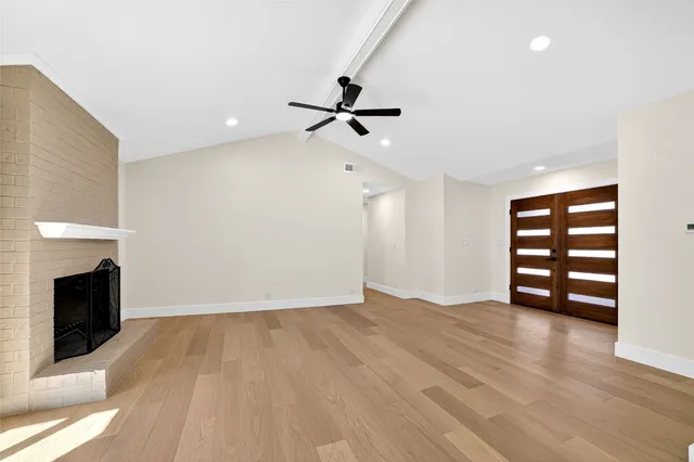 a kitchen with stainless steel appliances white cabinets and a stove top oven