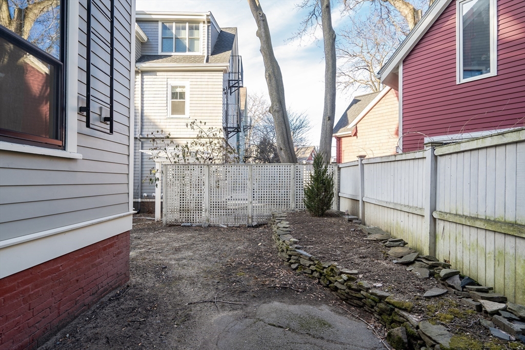 16 Traymore Street, Unit 16 Cambridge, MA 02140 - Photo 20 of 22 a view of a house with a yard