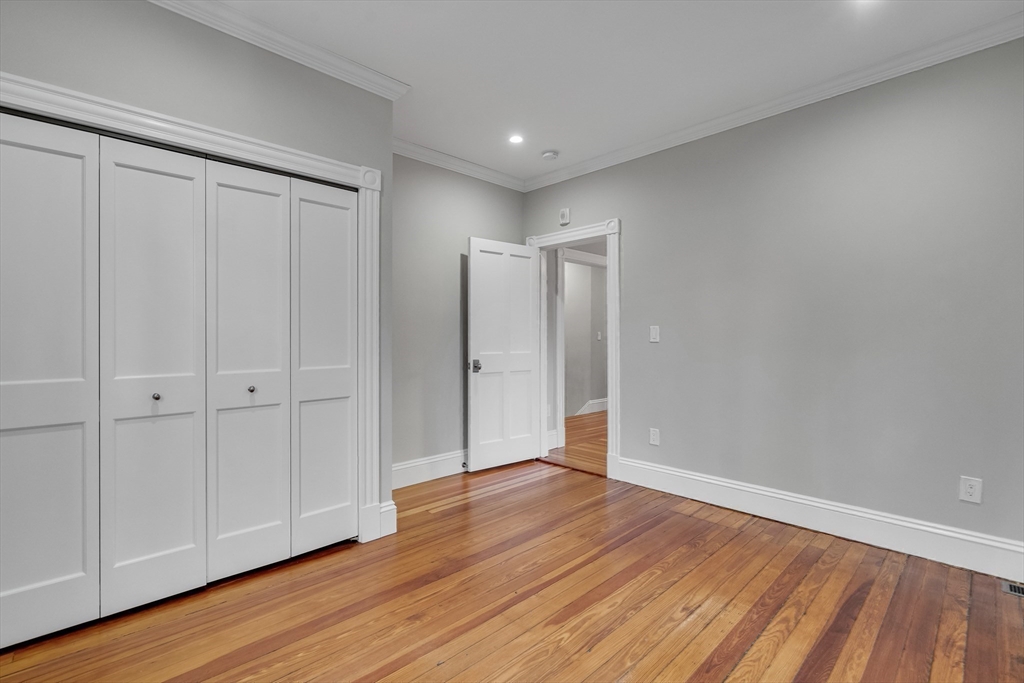 16 Traymore Street, Unit 16 Cambridge, MA 02140 - Photo 9 of 22 a view of an empty room with wooden floor
