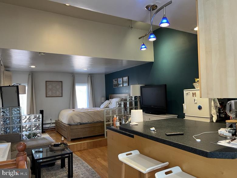 a living room with furniture and flat screen tv