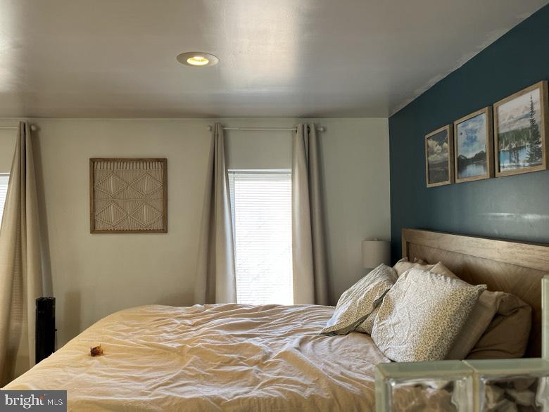 1202 South Street Philadelphia, PA 19147 - Photo 4 of 7 a bedroom with a bed and painting on the wall