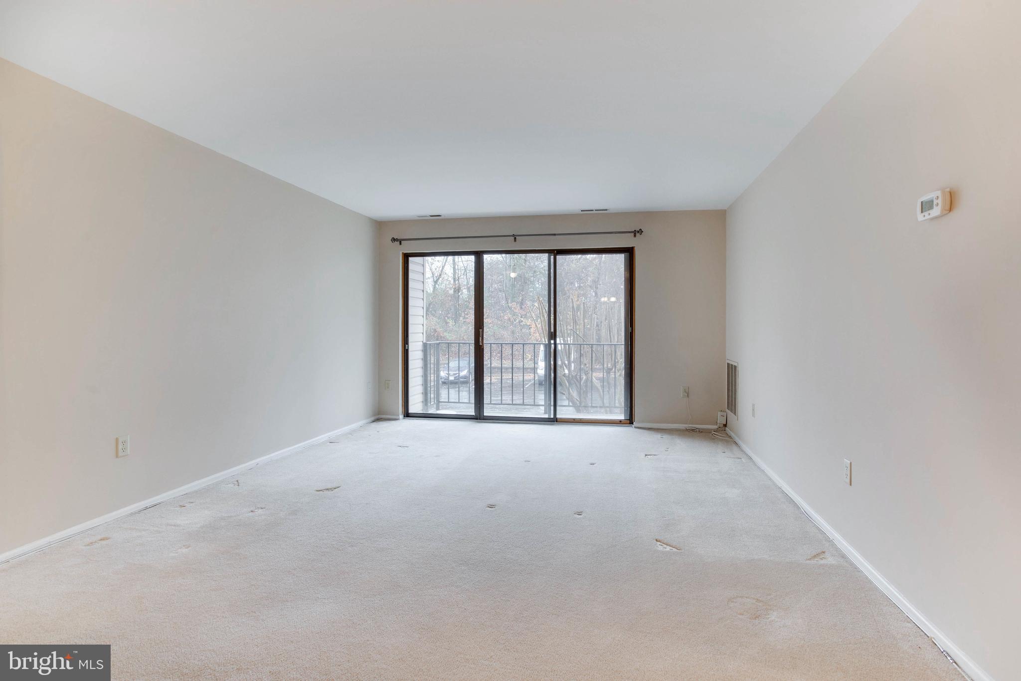 2570 Riva Road, Unit 13C Annapolis, MD 21401 - Photo 4 of 24 Large living room with access to outdoor balcony