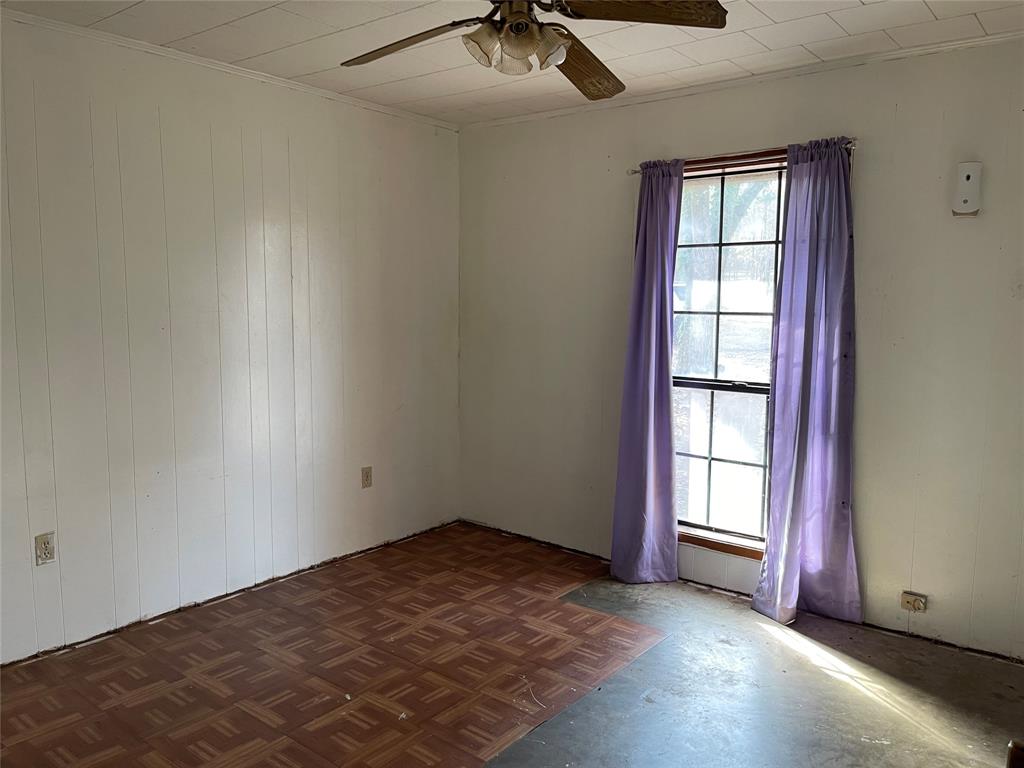 270 Layfield Road Coushatta, LA 71019 - Photo 16 of 22 an empty room with windows and chandelier fan