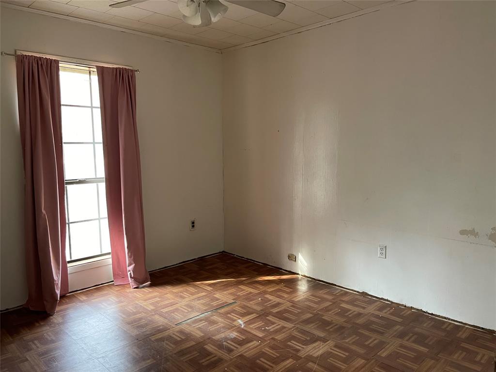 270 Layfield Road Coushatta, LA 71019 - Photo 17 of 22 an empty room with wooden floor and windows