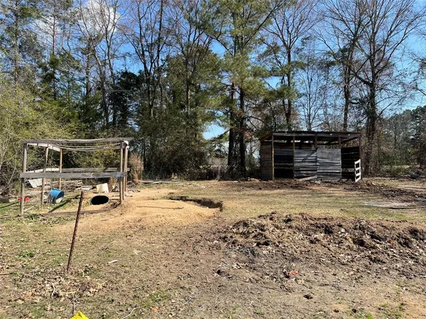 a view of a yard with a tree