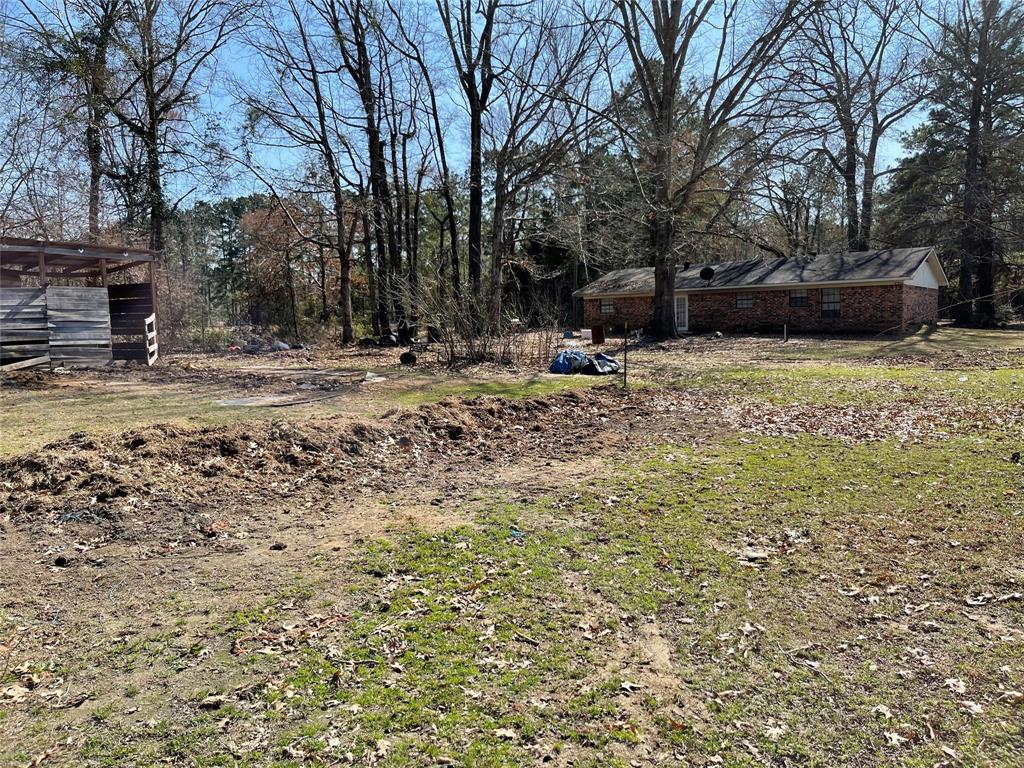 270 Layfield Road Coushatta, LA 71019 - Photo 6 of 22 a view of a backyard with large trees