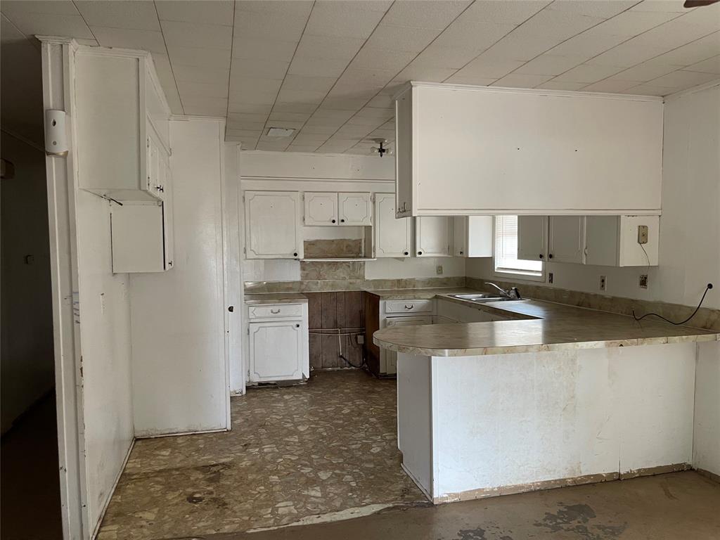 270 Layfield Road Coushatta, LA 71019 - Photo 7 of 22 a kitchen with stainless steel appliances granite countertop a sink a stove a refrigerator and white cabinets