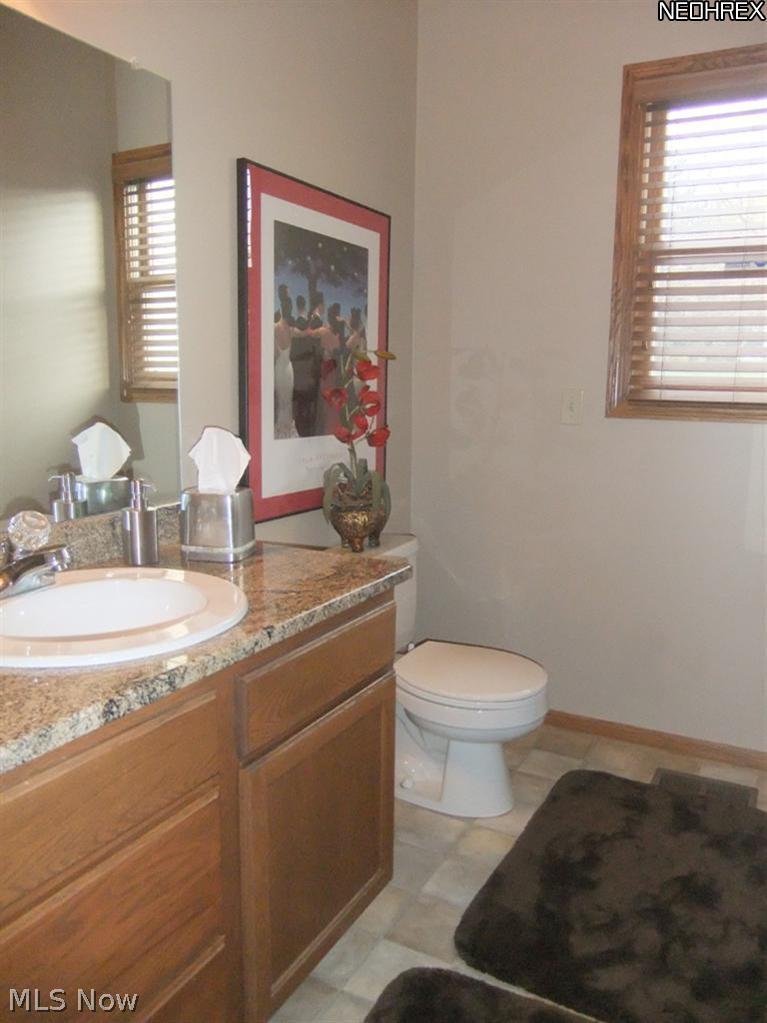 3795 Stonebridge Boulevard Akron, OH 44321 - Photo 7 of 24 A half bathroom and separate first floor laundry room are located off of the kitchen.