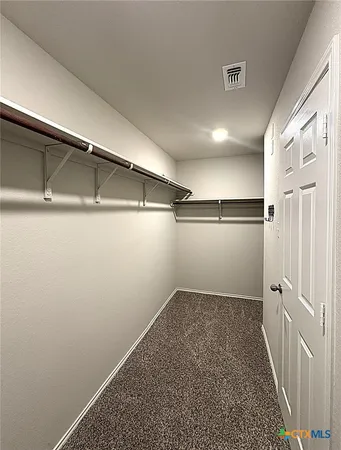 a view of a room with racks on the wall