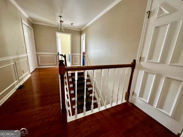 a view of entryway with wooden floor