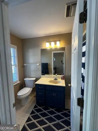 a bed room with a bed and a dresser