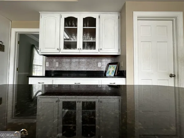 a kitchen with a stove and a microwave