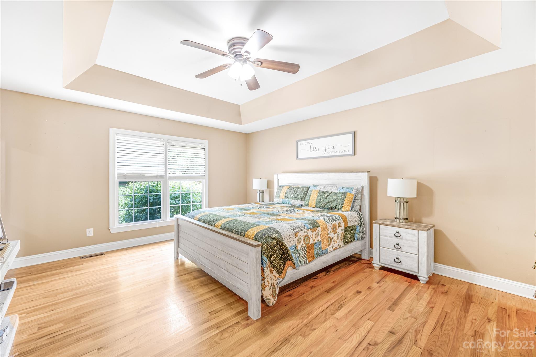 1463 Brookstone Drive Hickory, NC 28602 - Photo 12 of 40 a bedroom with a large bed and a chandelier