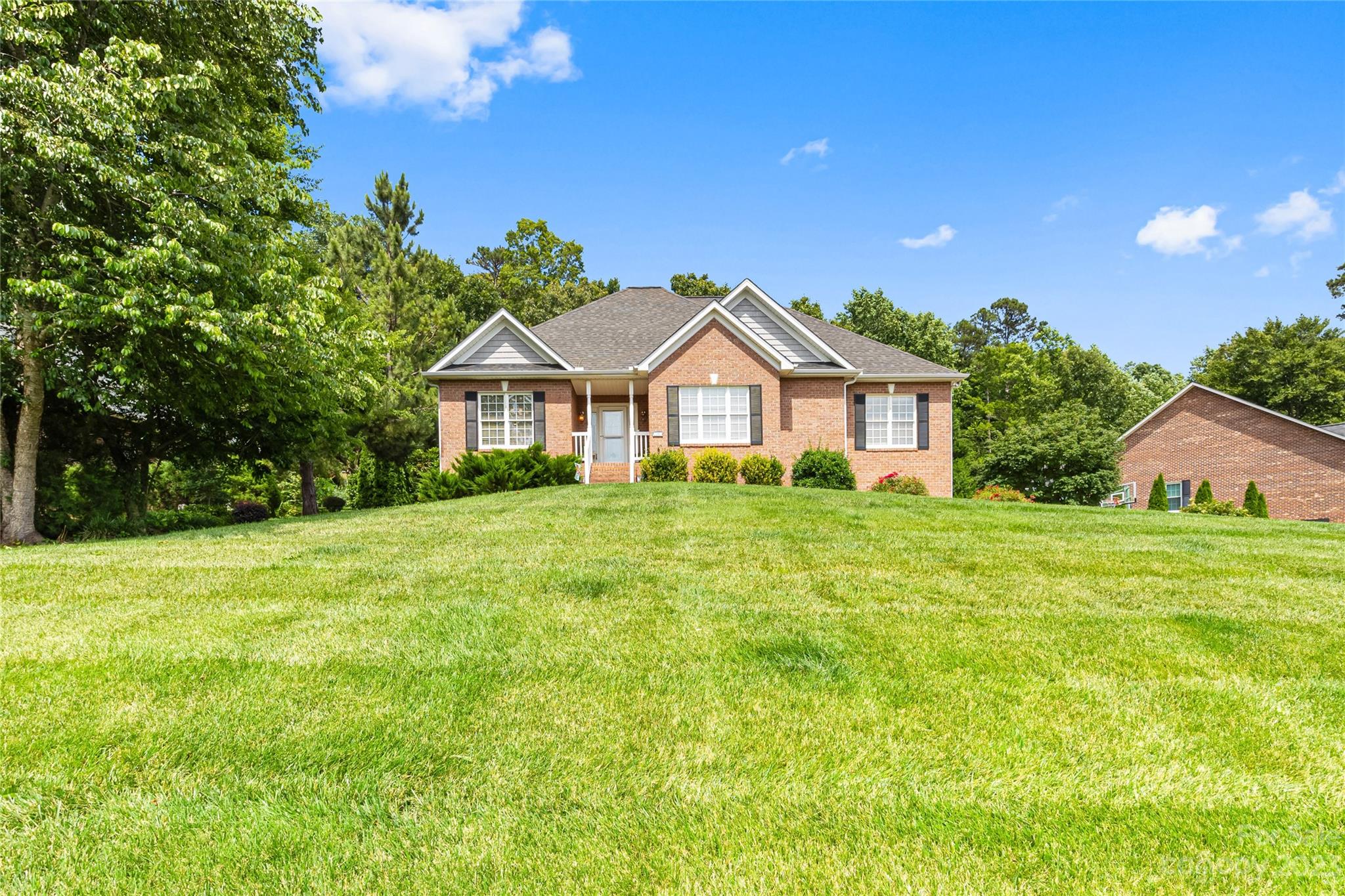 1463 Brookstone Drive Hickory, NC 28602 - Photo 34 of 40 a front view of a house with a garden