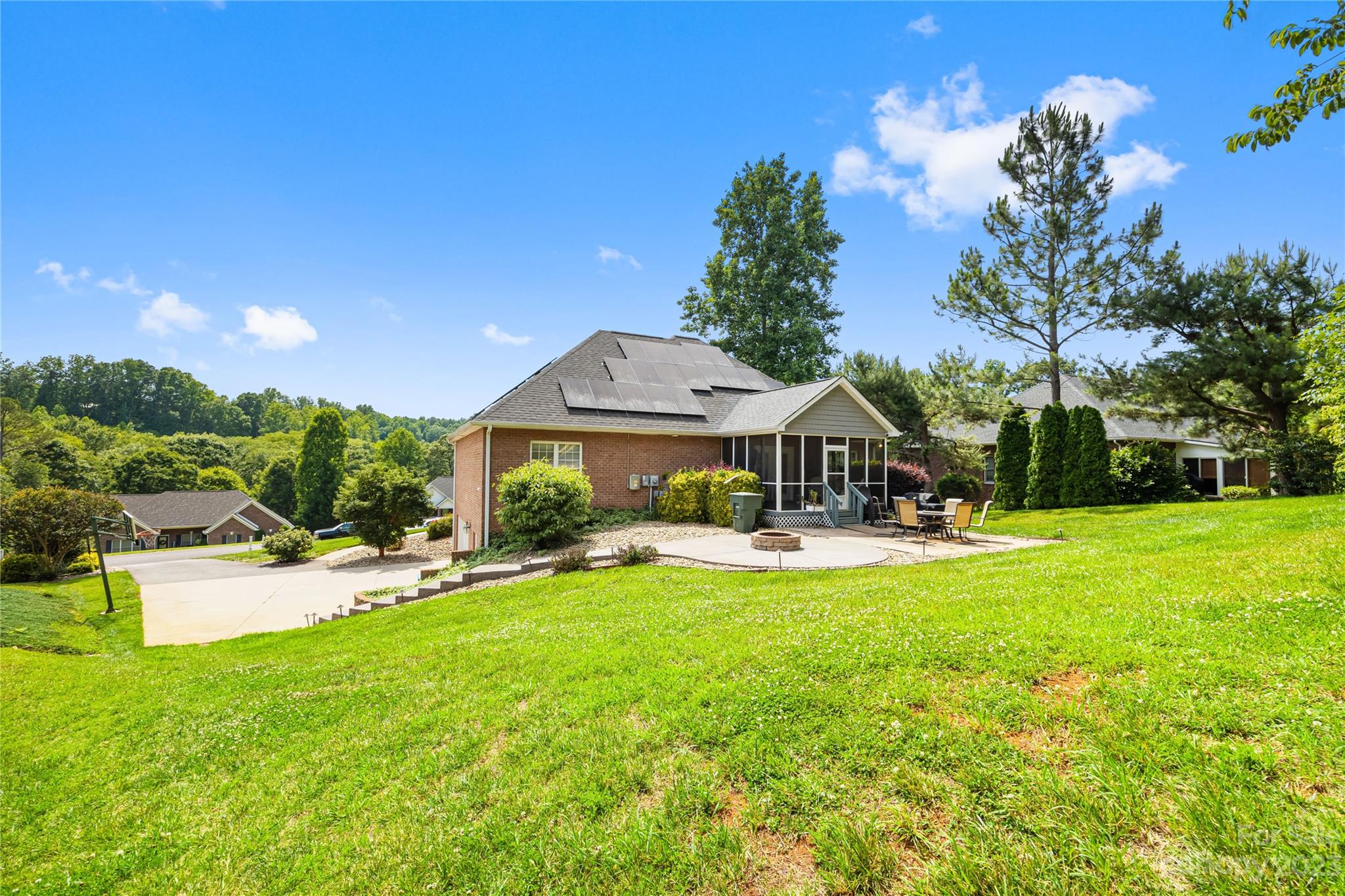 1463 Brookstone Drive Hickory, NC 28602 - Photo 38 of 40 a view of a house with swimming pool and sitting area
