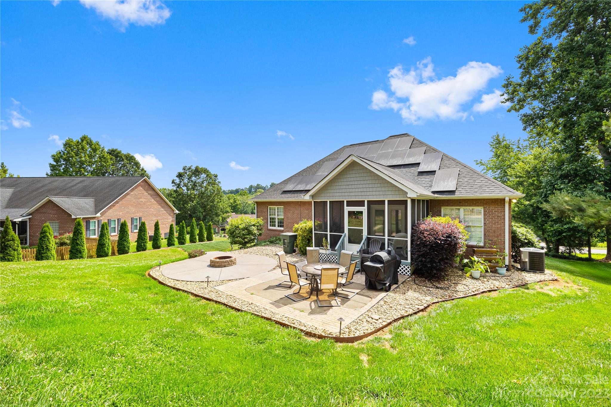 1463 Brookstone Drive Hickory, NC 28602 - Photo 39 of 40 a view of a house with a yard patio and fire pit
