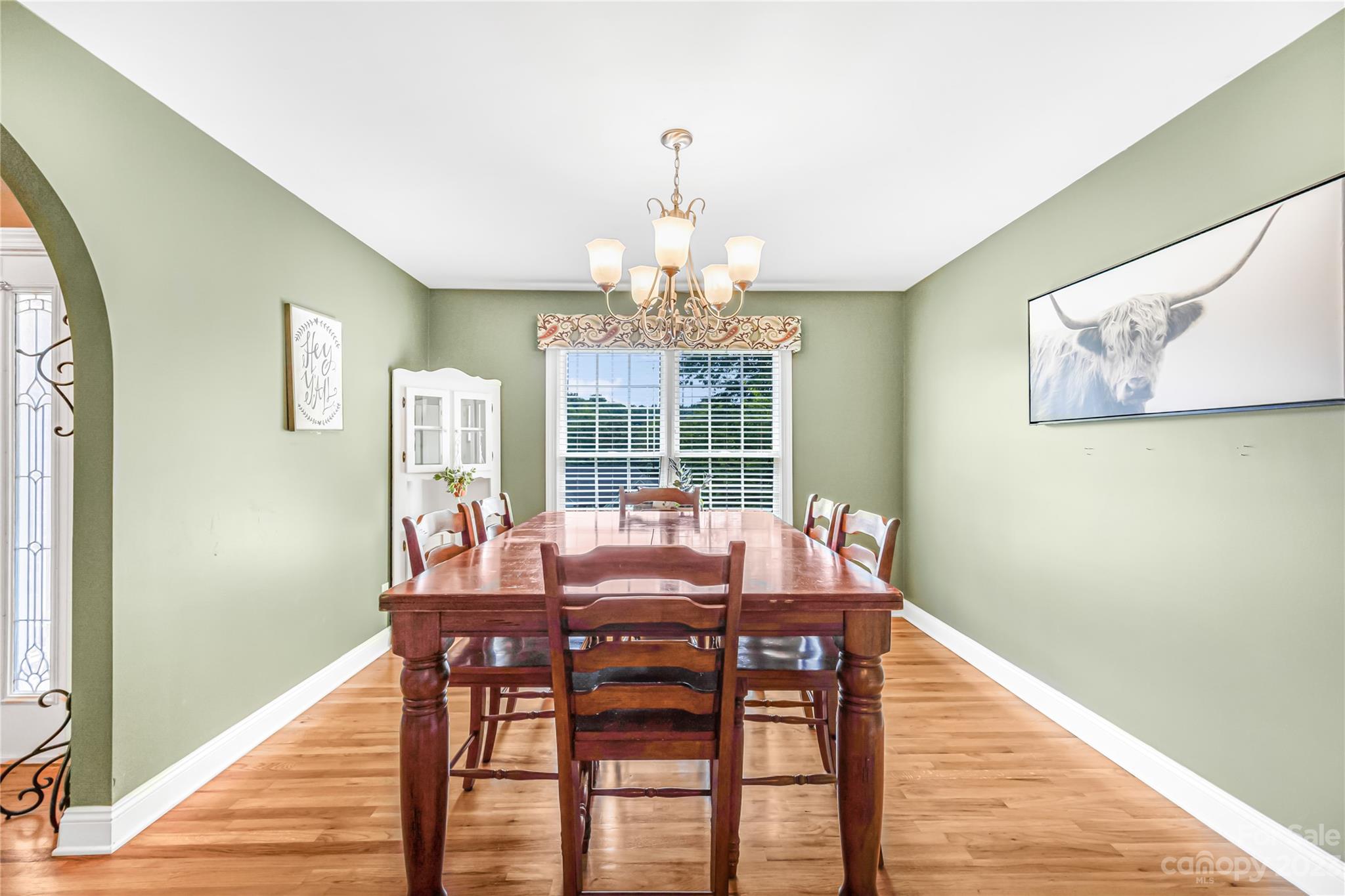 1463 Brookstone Drive Hickory, NC 28602 - Photo 8 of 40 a view of a dining room with furniture wooden floor and chandelier