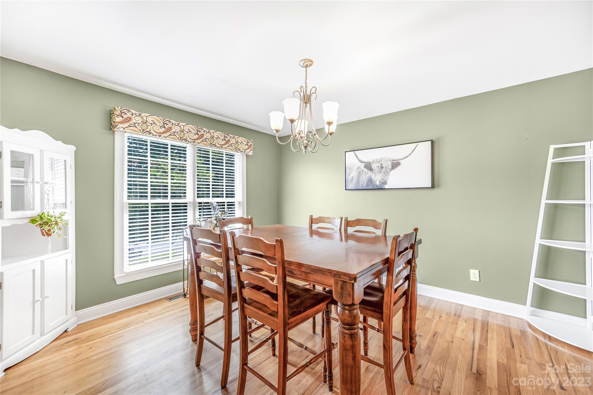 1463 Brookstone Drive Hickory, NC 28602 - Photo 9 of 40 a view of a dining room with furniture wooden floor and chandelier