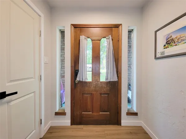 a bedroom with furniture and a window