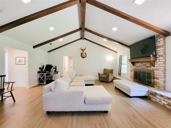 a living room with furniture and a window