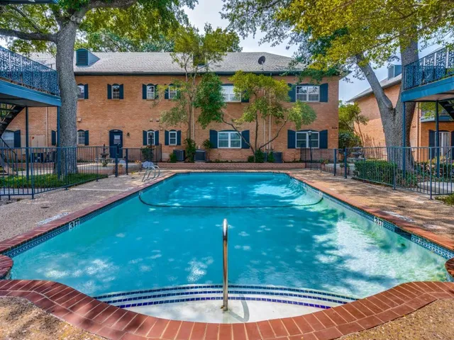 a view of a house with swimming pool
