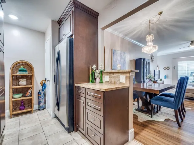 a view of kitchen with furniture and wooden floor