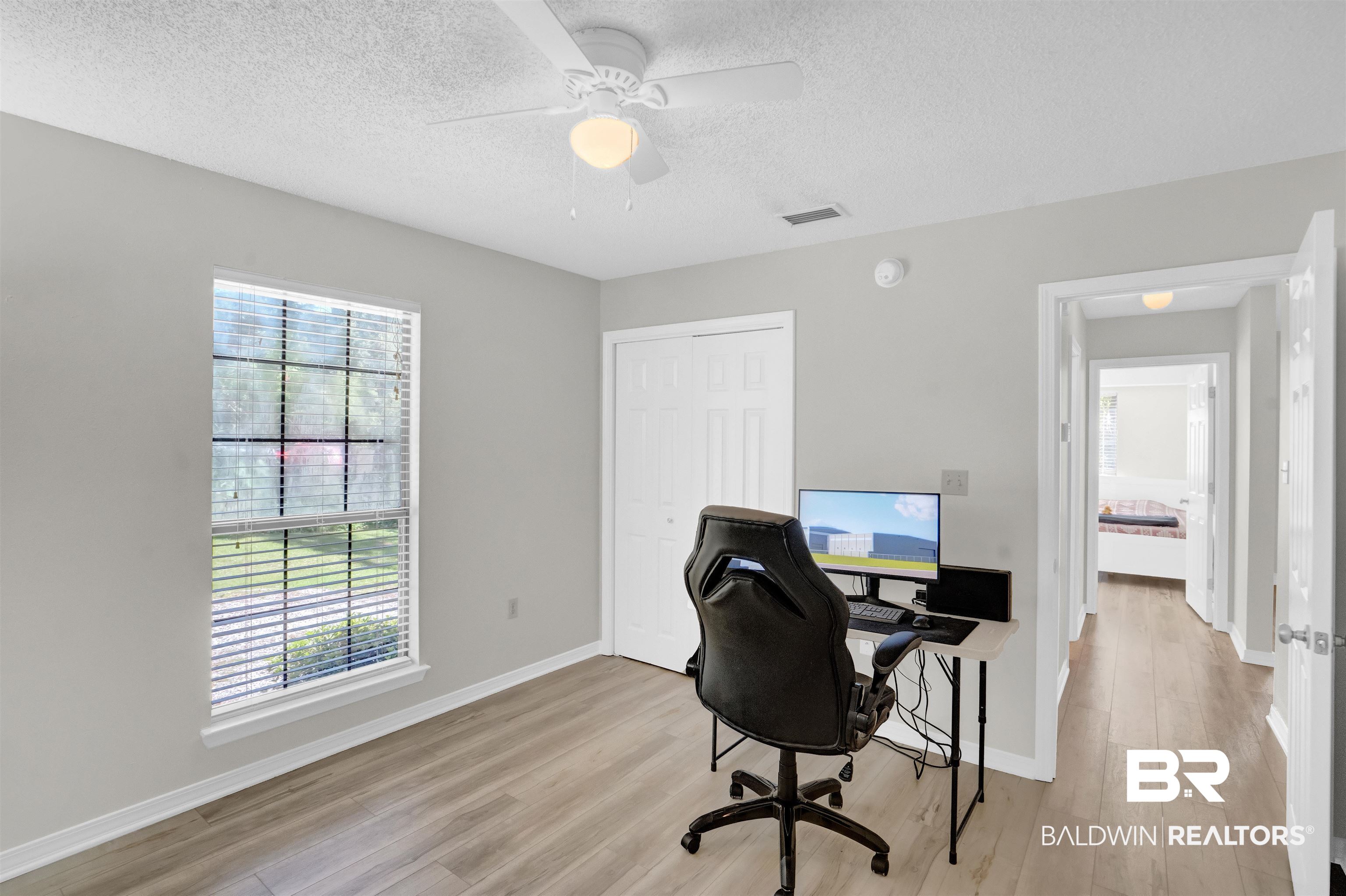 30871 Stanton Road Spanish Fort, AL 36527 - Photo 16 of 35 Office space featuring ceiling fan, light wood-type flooring, and a textured ceiling