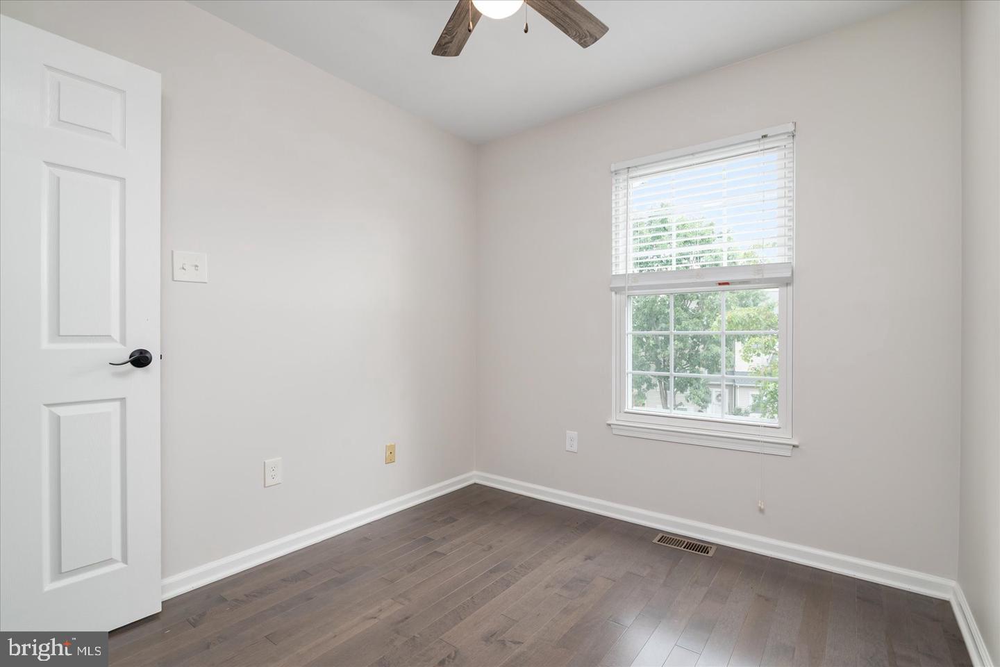 2441 Winding Ridge Road Odenton, MD 21113 - Photo 11 of 20 an empty room with a window and a ceiling fan