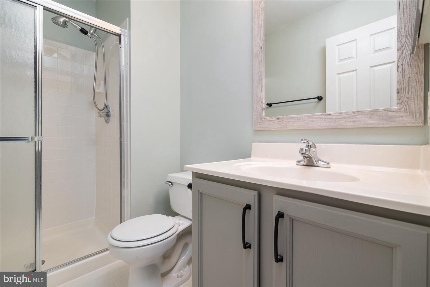 2441 Winding Ridge Road Odenton, MD 21113 - Photo 15 of 20 a bathroom with a sink toilet and shower