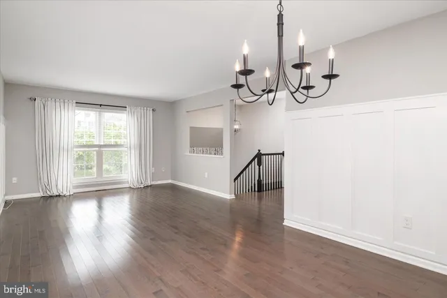 a view of an entryway with wooden floor