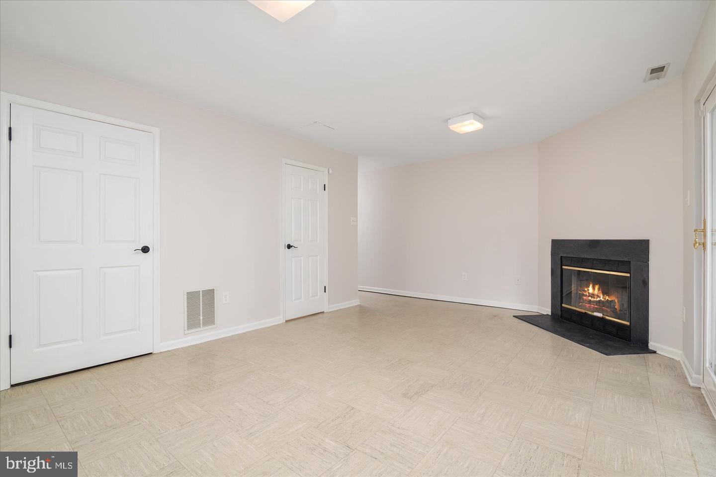 2441 Winding Ridge Road Odenton, MD 21113 - Photo 5 of 20 a view of an empty room with a fireplace