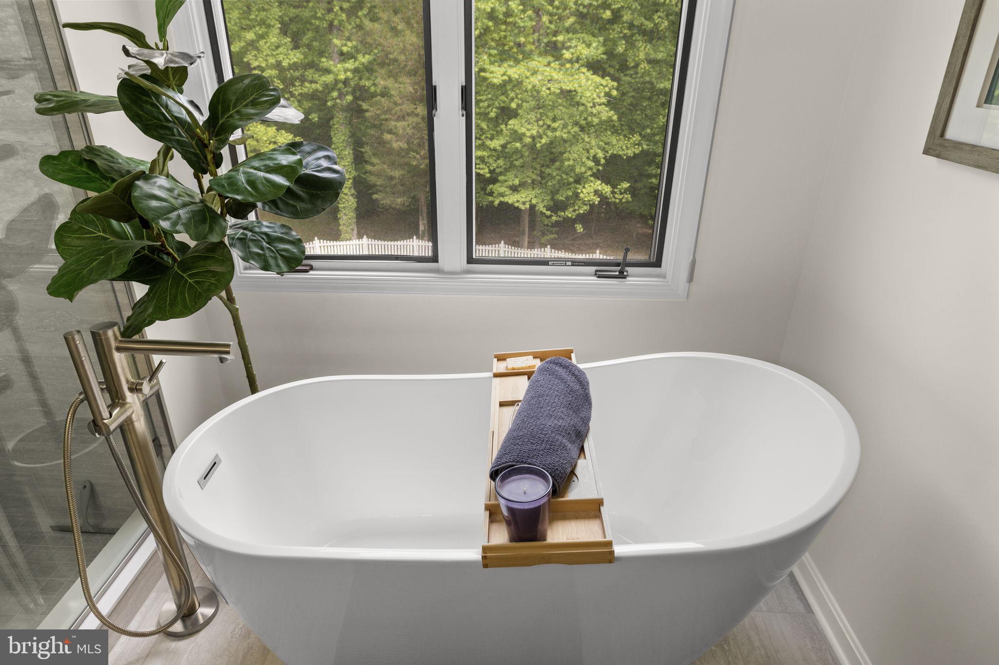 100 Boscobel Road Fredericksburg, VA 22405 - Photo 42 of 67 a white bath tub sitting in a bathroom