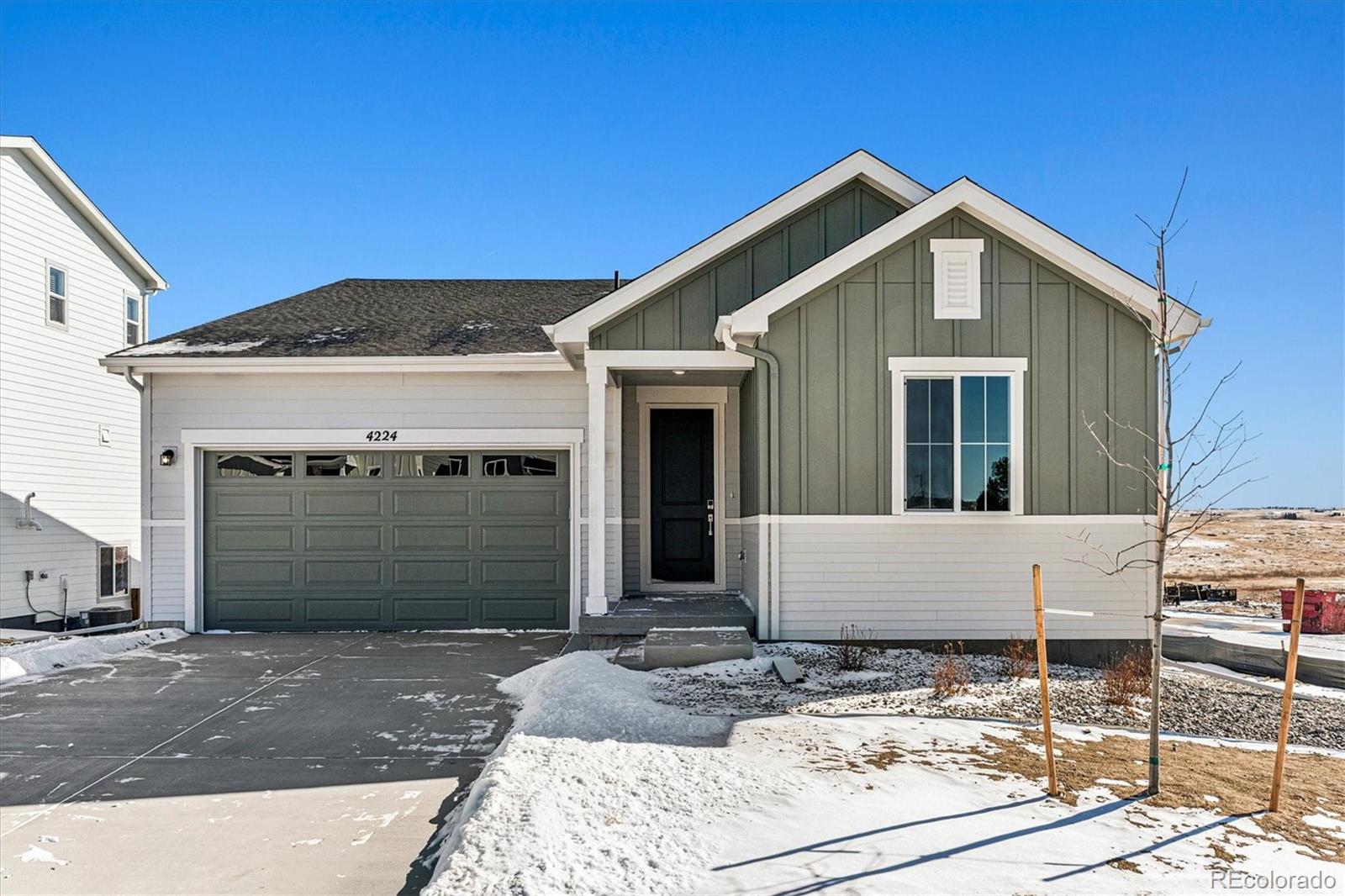 a front view of a house with garage
