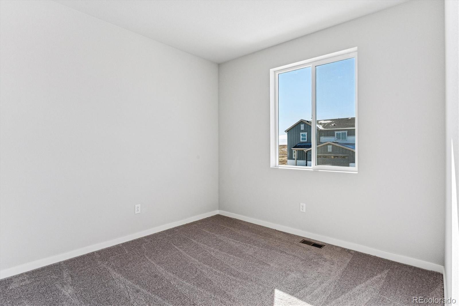 4224 Gozzer Ranch Drive Elizabeth, CO 80107 - Photo 11 of 21 an empty room with a window