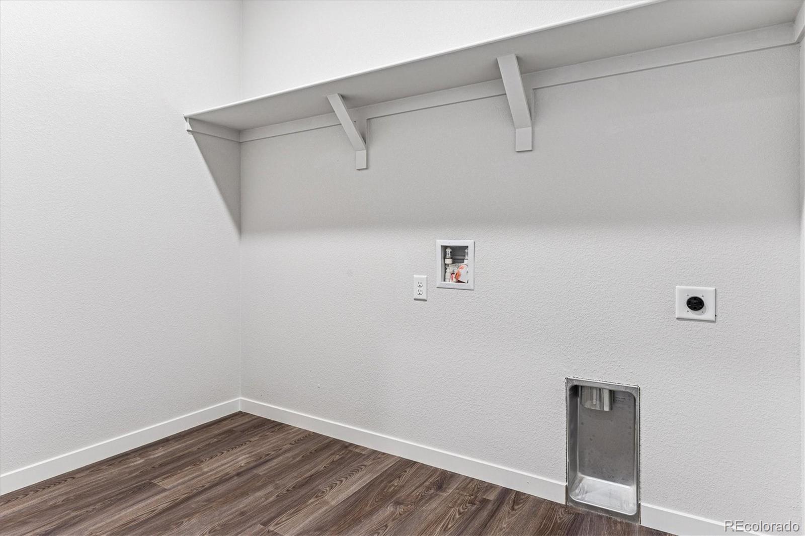 4224 Gozzer Ranch Drive Elizabeth, CO 80107 - Photo 12 of 21 a view of a small space with racks on the wall