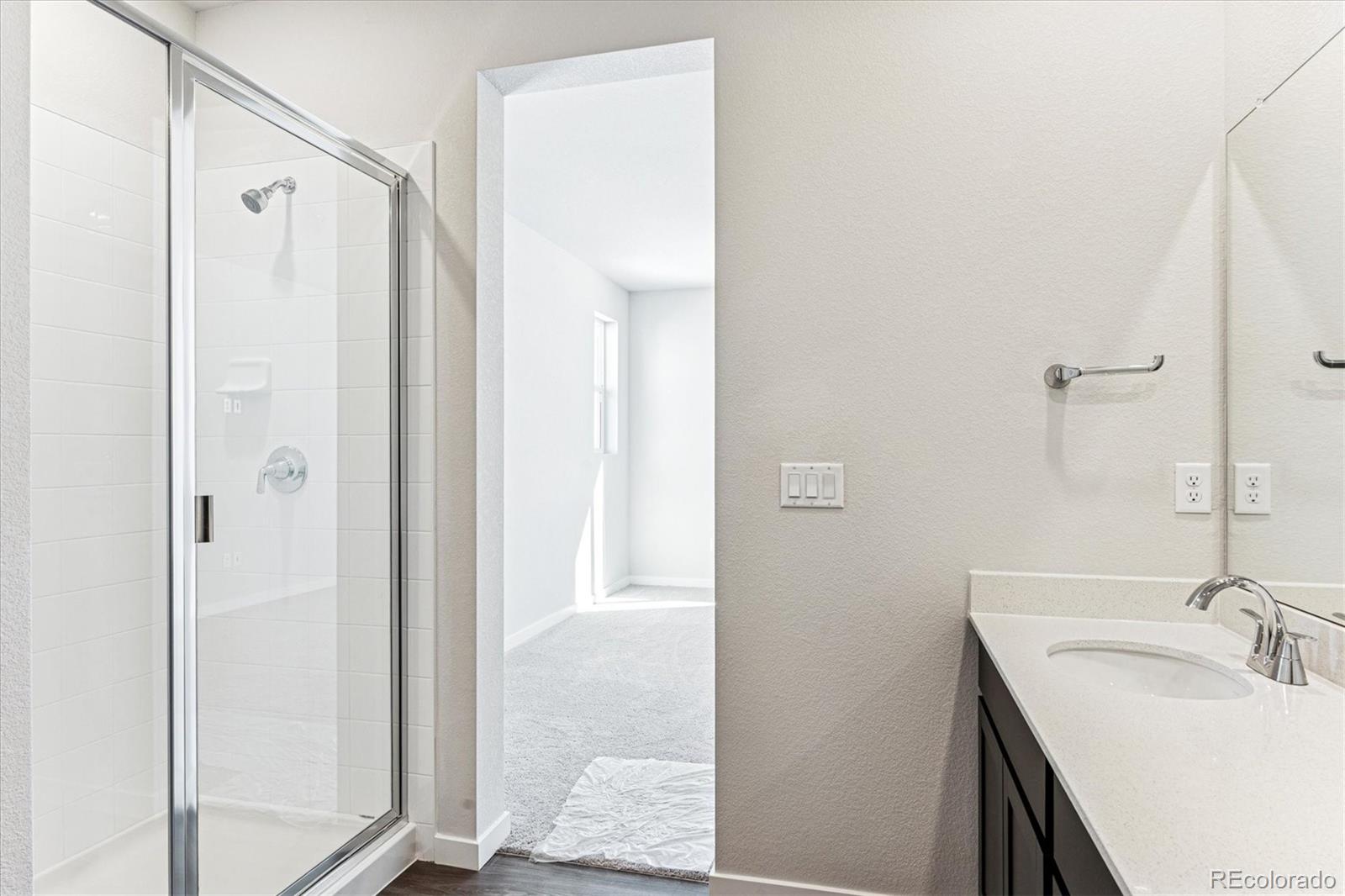 4224 Gozzer Ranch Drive Elizabeth, CO 80107 - Photo 16 of 21 a bathroom with a sink and a mirror