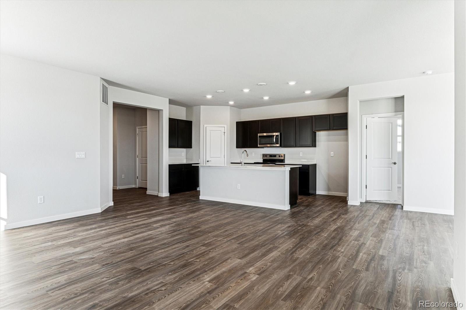 4224 Gozzer Ranch Drive Elizabeth, CO 80107 - Photo 2 of 21 a view of kitchen view wooden floor and electronic appliances