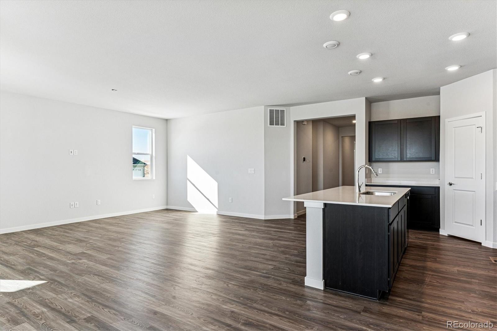 4224 Gozzer Ranch Drive Elizabeth, CO 80107 - Photo 5 of 21 a view of kitchen with wooden floor and electronic appliances