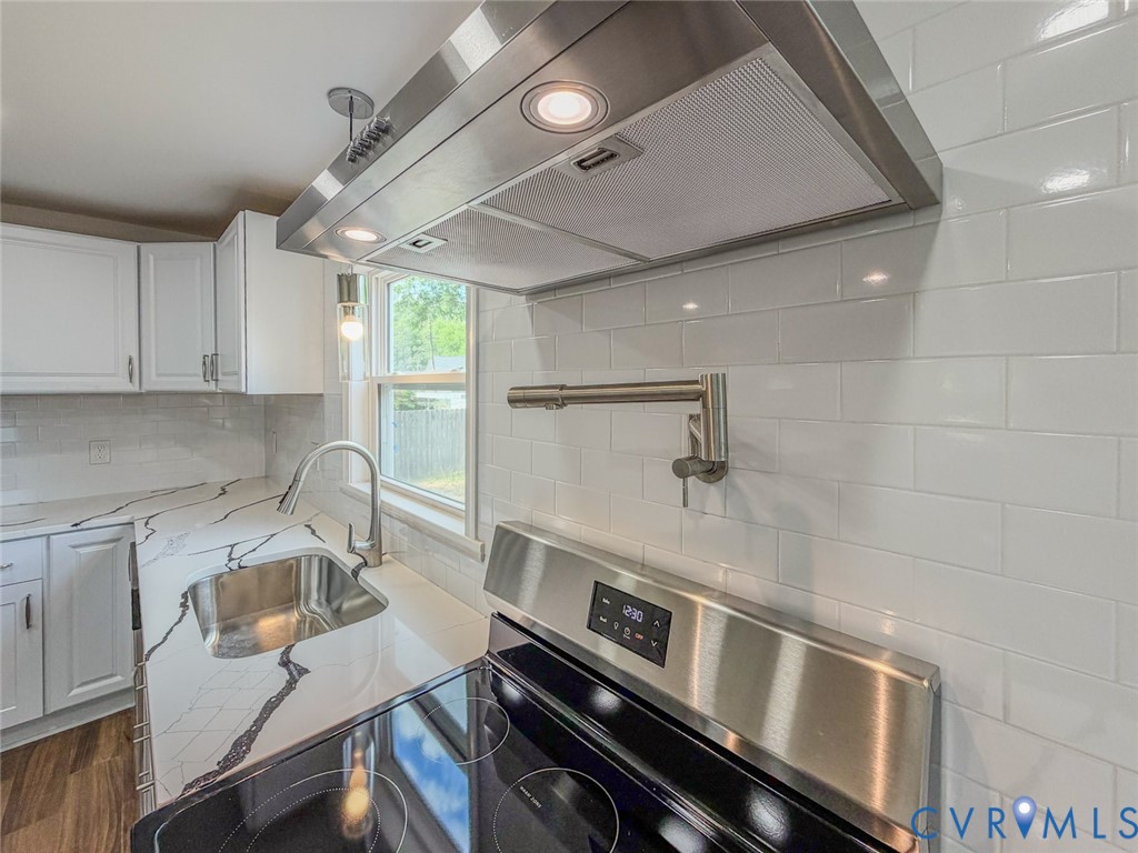 3409 Meadowbridge Road Richmond, VA 23222 - Photo 6 of 32 a kitchen with a sink appliances and cabinets