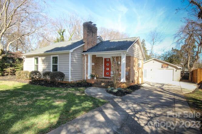 801 Fairbanks Road Charlotte, NC 28210 - Photo 39 of 39 a front view of a house with a garden